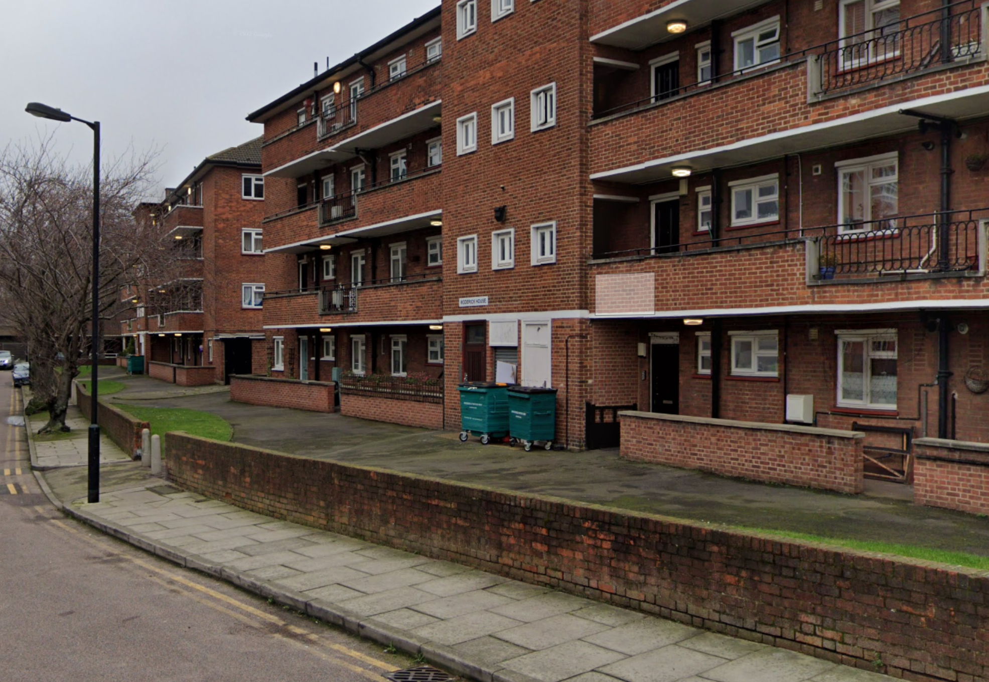 Roderick House in 2018, before the beginning of the works, showing the small grassed area in front of the block.